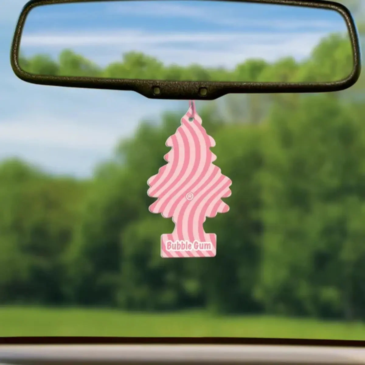 Little Trees Bubble Gum car air freshener hanging from rearview mirror inside vehicle for wholesale product display