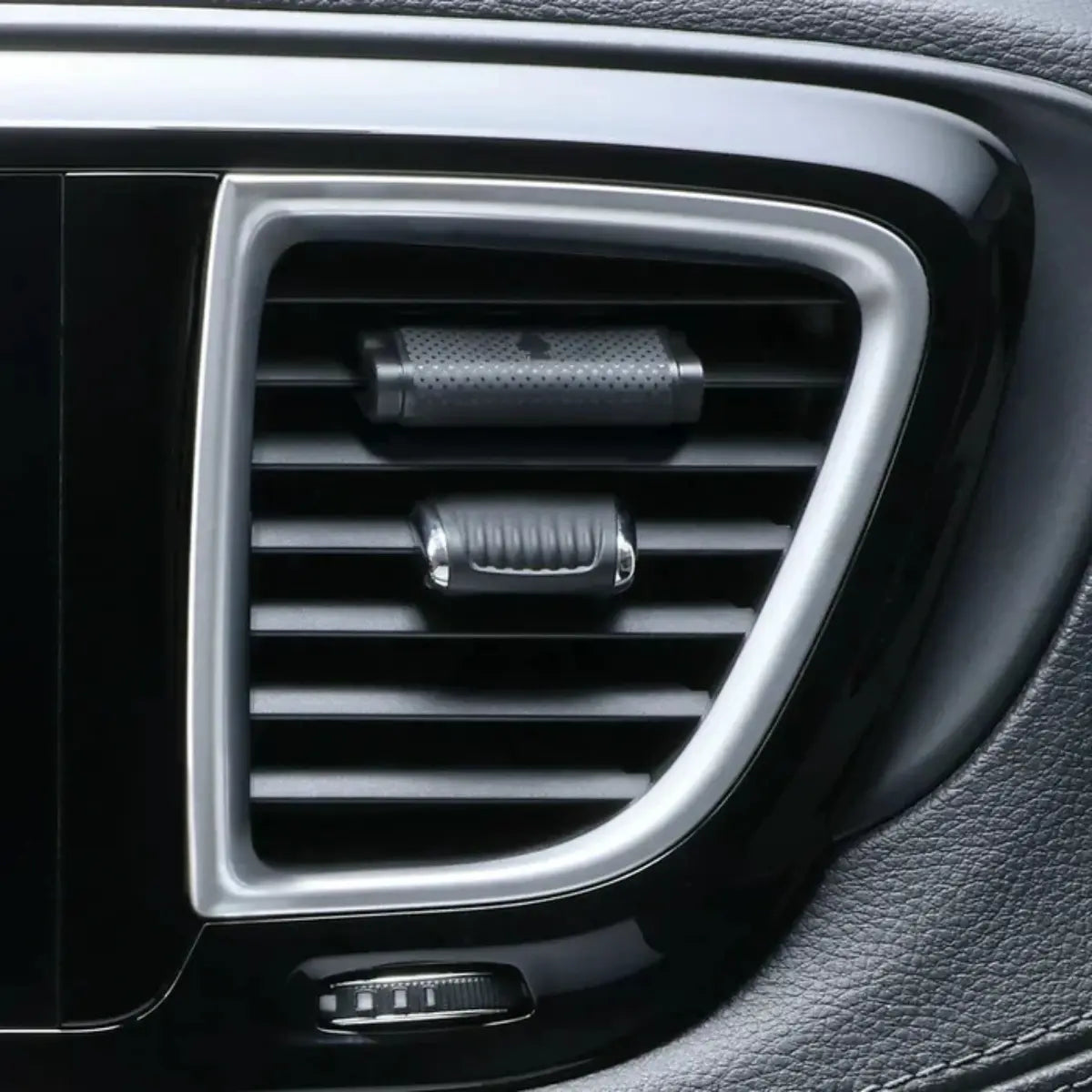 Little Trees New Car Scent Vent Wrap installed on a car air vent, blending in with the interior for discreet freshness.