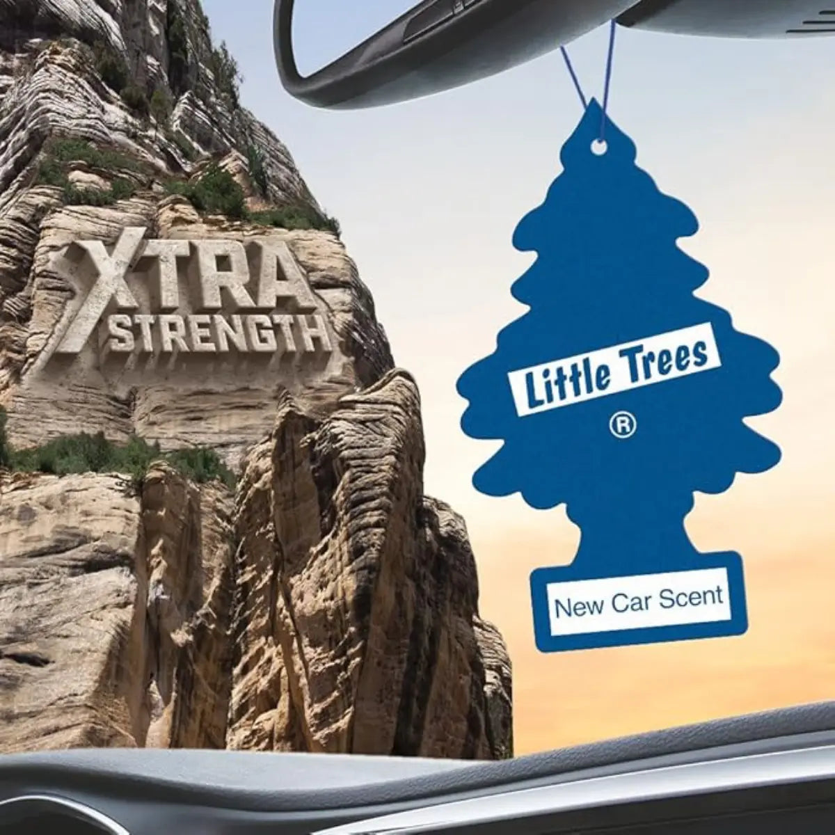 Little Trees New Car Scent air freshener hanging in vehicle with Xtra Strength label