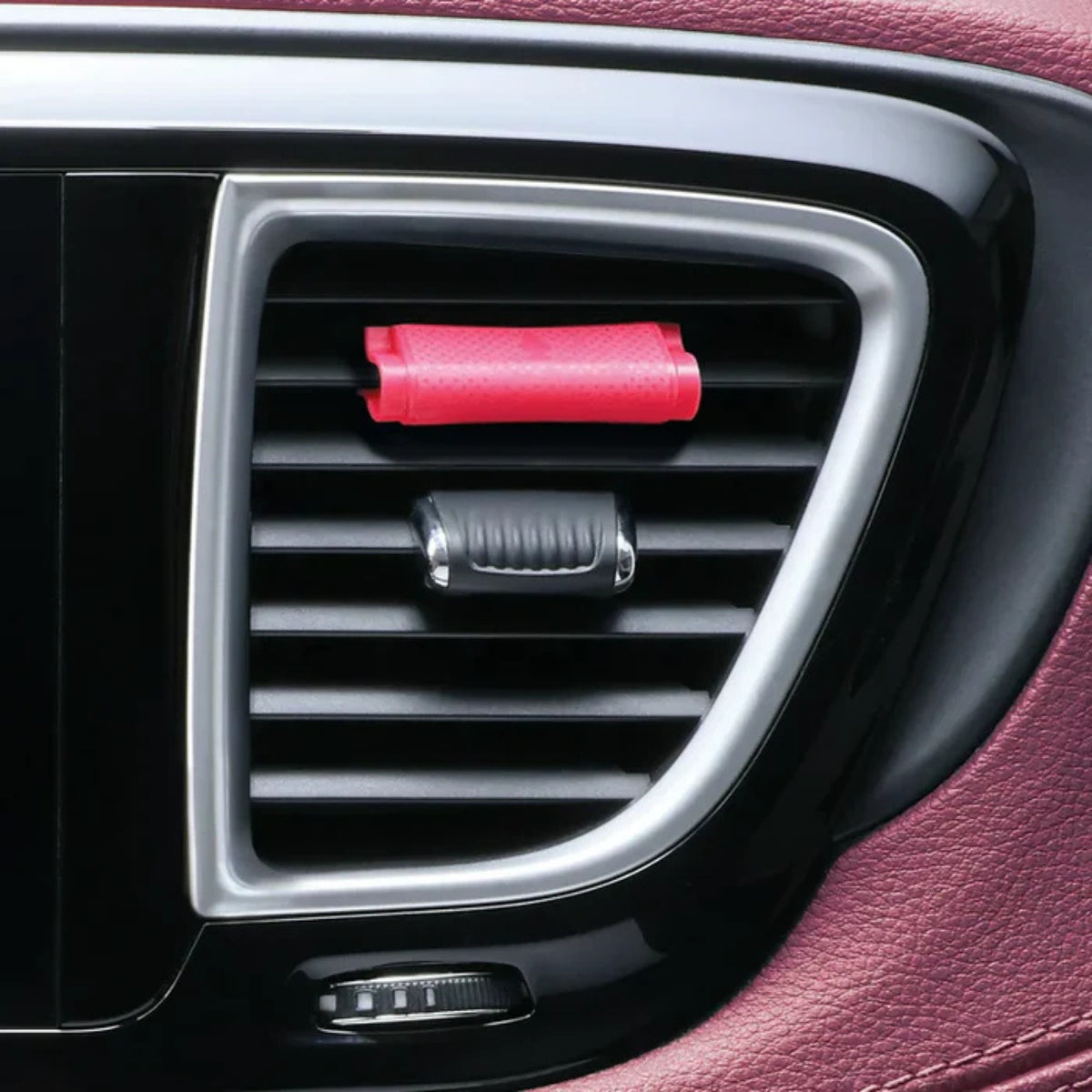 Little Trees Watermelon Vent Wrap installed on a vehicle air vent, delivering a juicy summer fragrance with a discreet pink clip-on design.